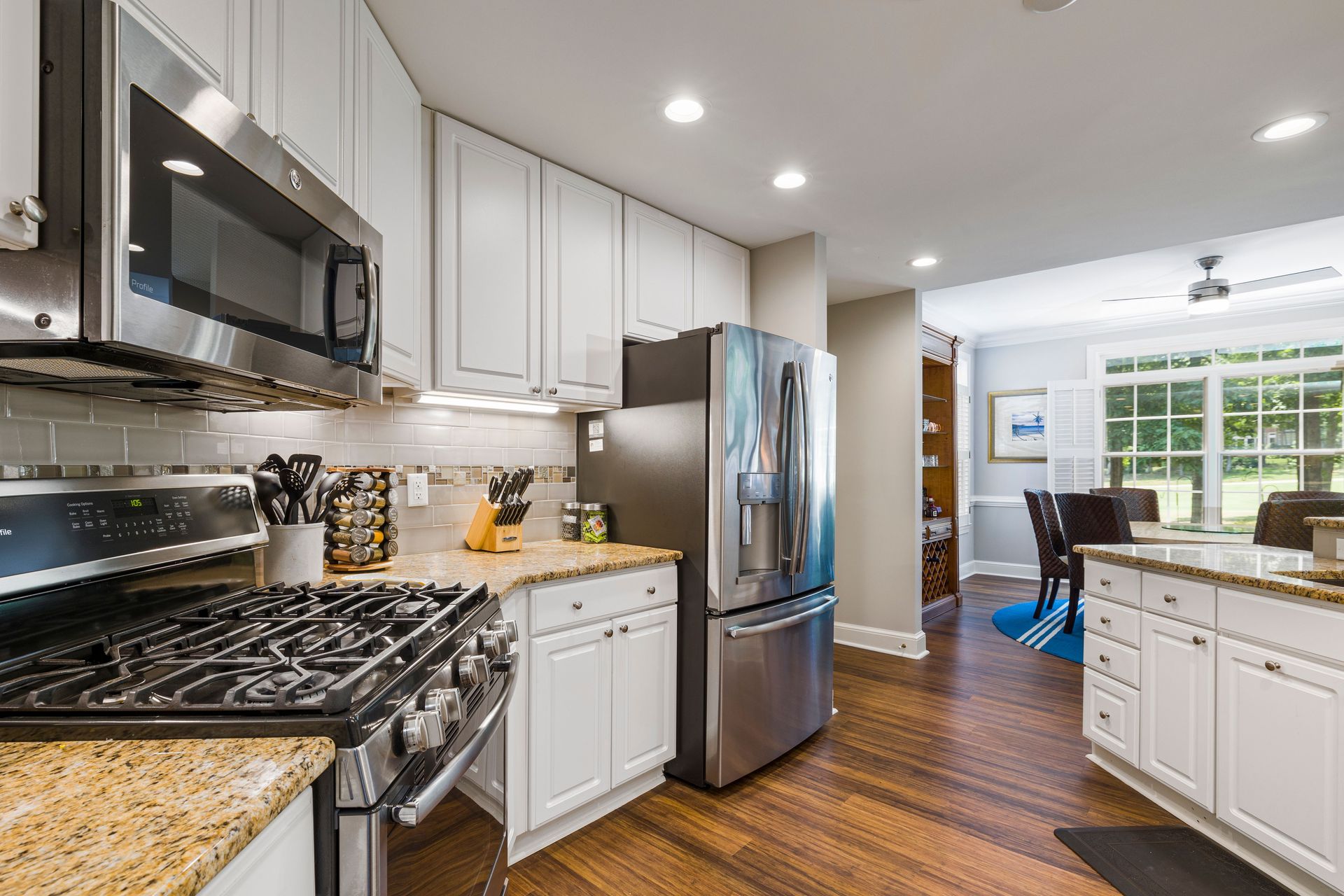 Contemporary kitchen design with stainless steel appliances and granite countertops.